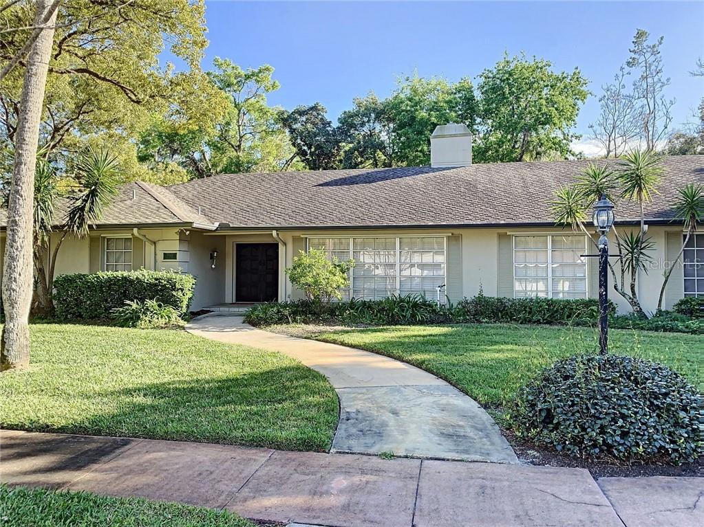 5522 Carlton Road New Port Richey, FL 34652 - Photo 1 of 1 a front view of a house with a yard and garage