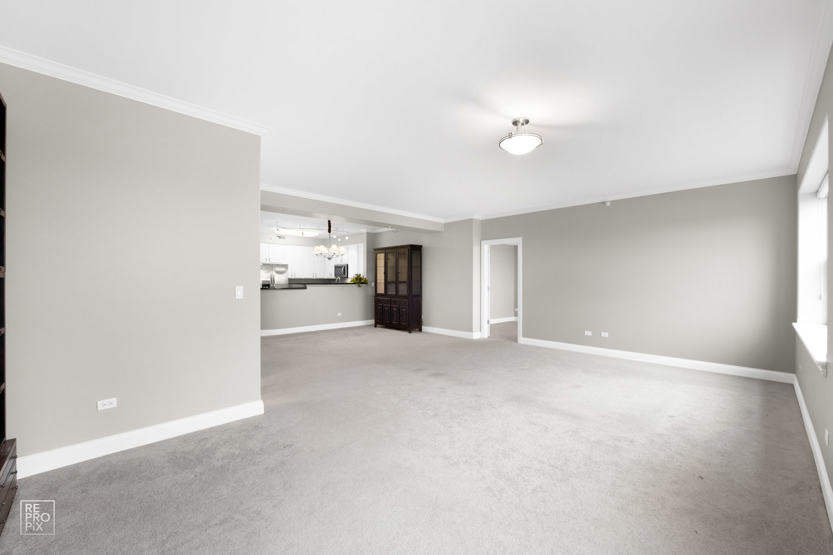 1 Itasca Place, Unit 207 Addison, IL 60143 - Photo 13 of 24 a view of empty room with kitchen