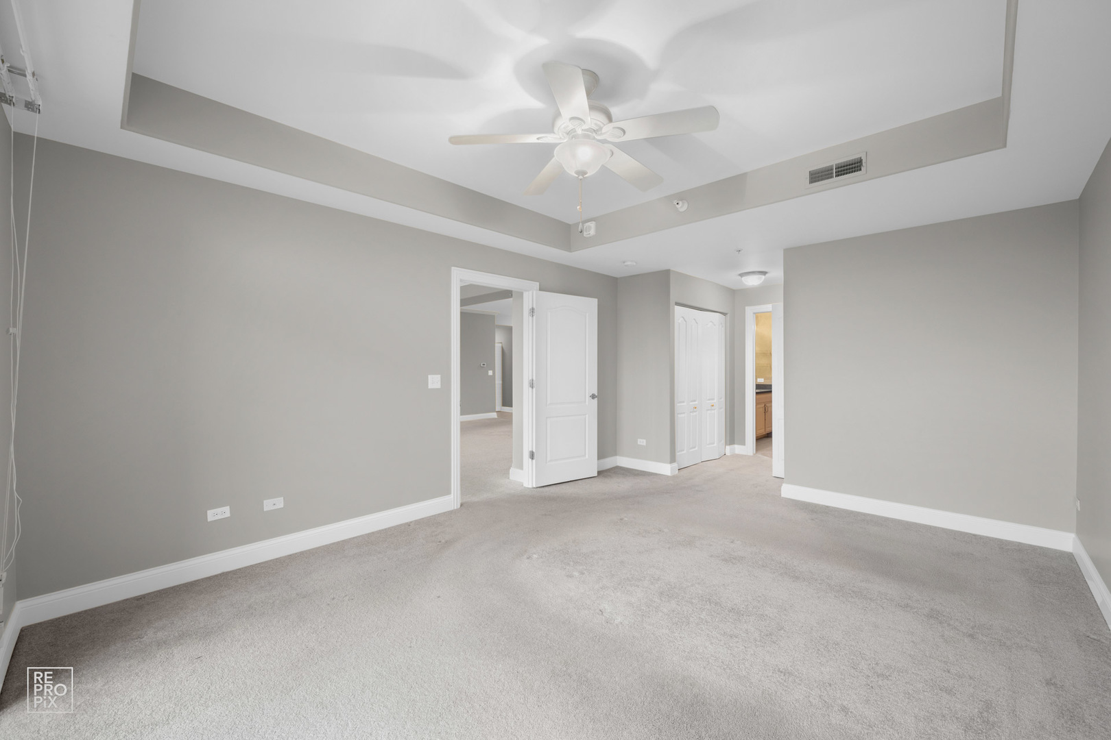 1 Itasca Place, Unit 207 Addison, IL 60143 - Photo 15 of 24 a view of an empty room with a ceiling fan
