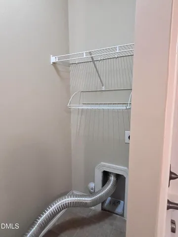 a bathroom with a window and a white door