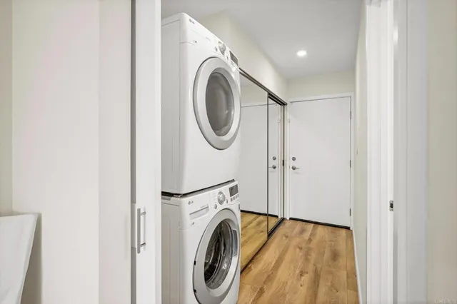 a view of a hallway with washer and dryer