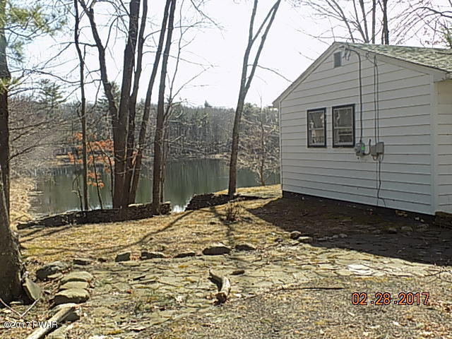 136 Beech Road Dingmans Ferry, PA 18328 - Photo 3 of 13 a view of a backyard of the house