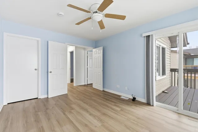 a view of livingroom with hardwood floor and a ceiling fan