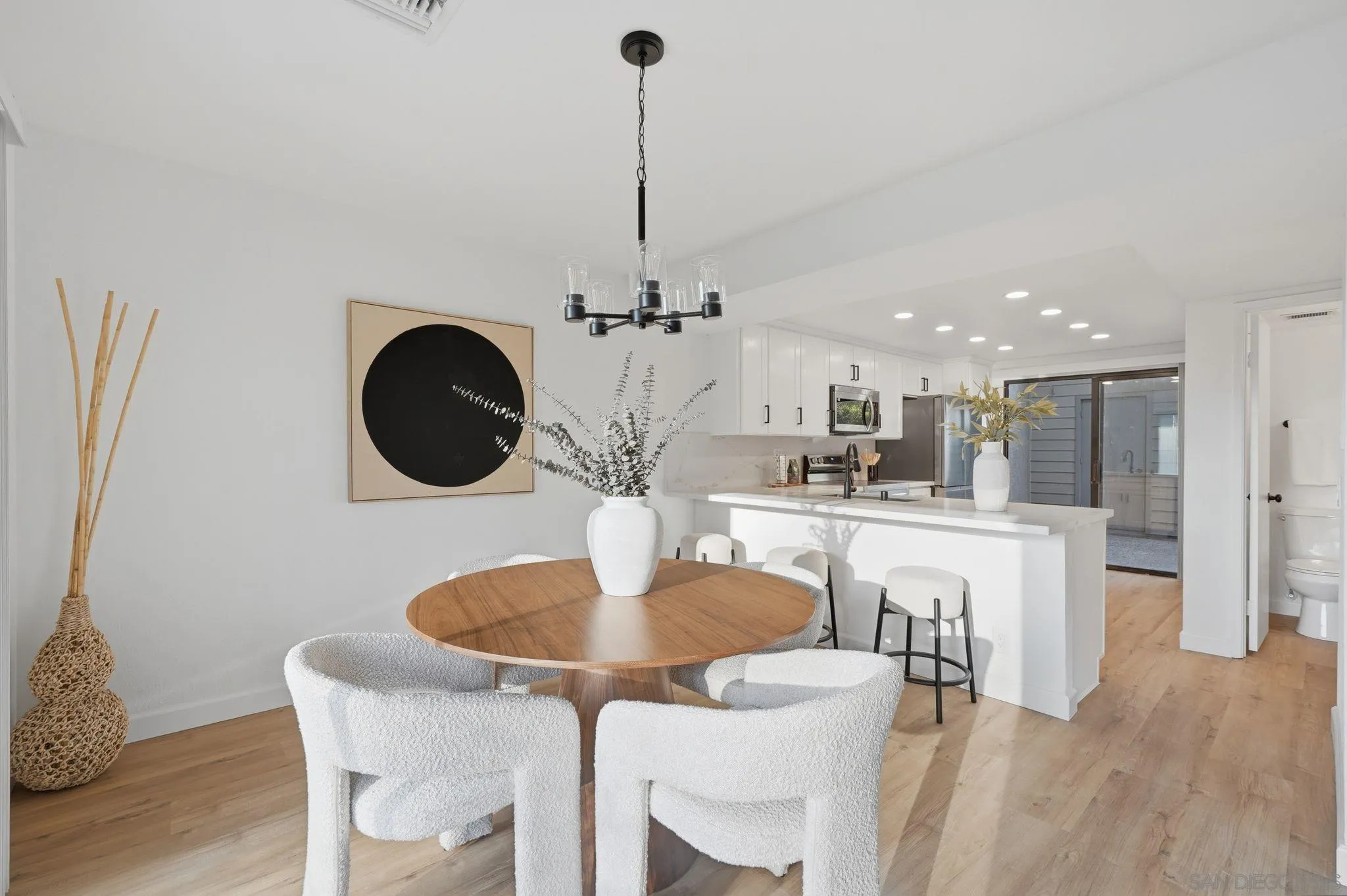 10450 Ridgewater Lane San Diego, CA 92131 - Photo 11 of 47 a kitchen with a table and chairs