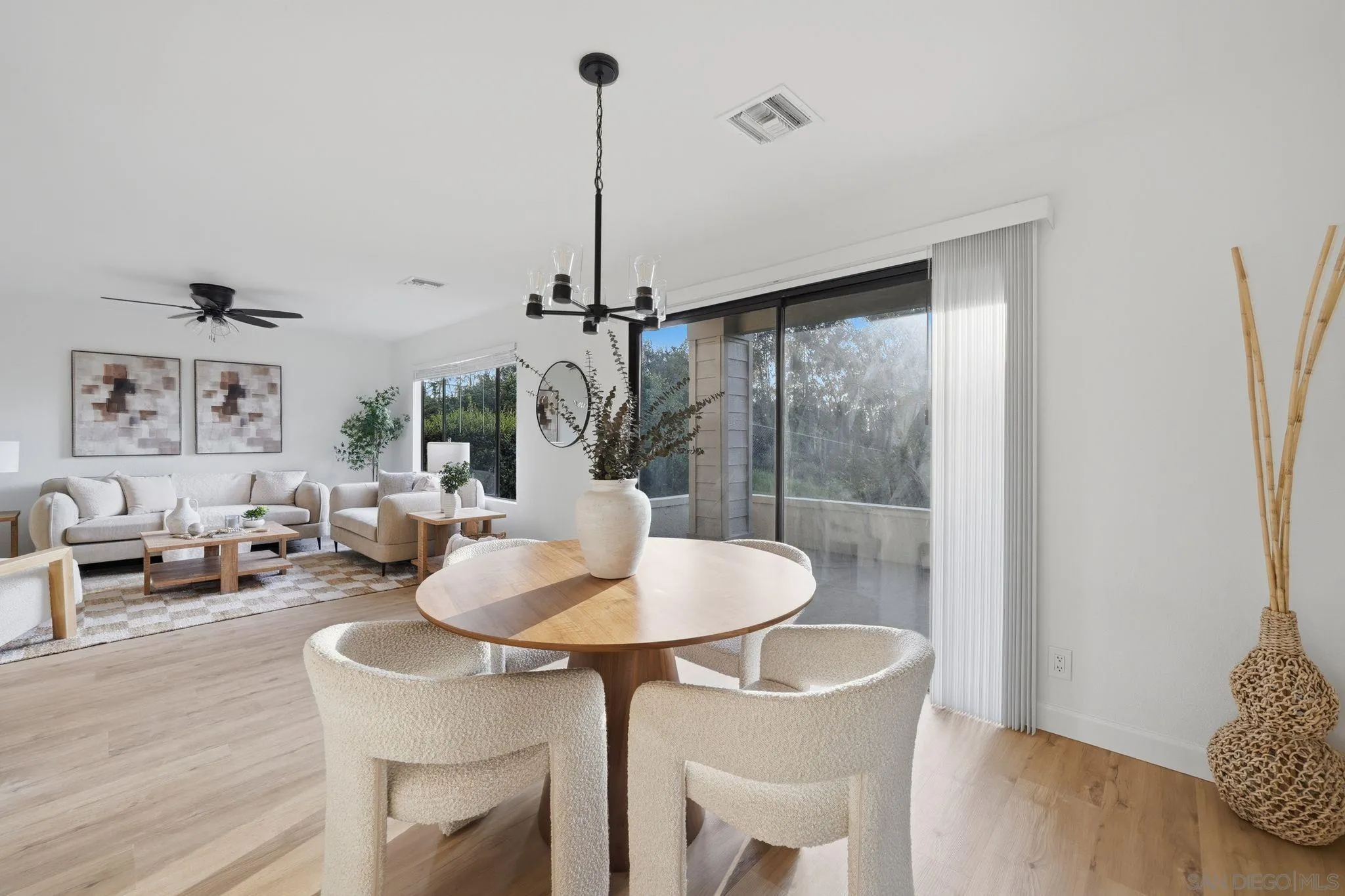 10450 Ridgewater Lane San Diego, CA 92131 - Photo 13 of 47 a living room with furniture and a wooden floor