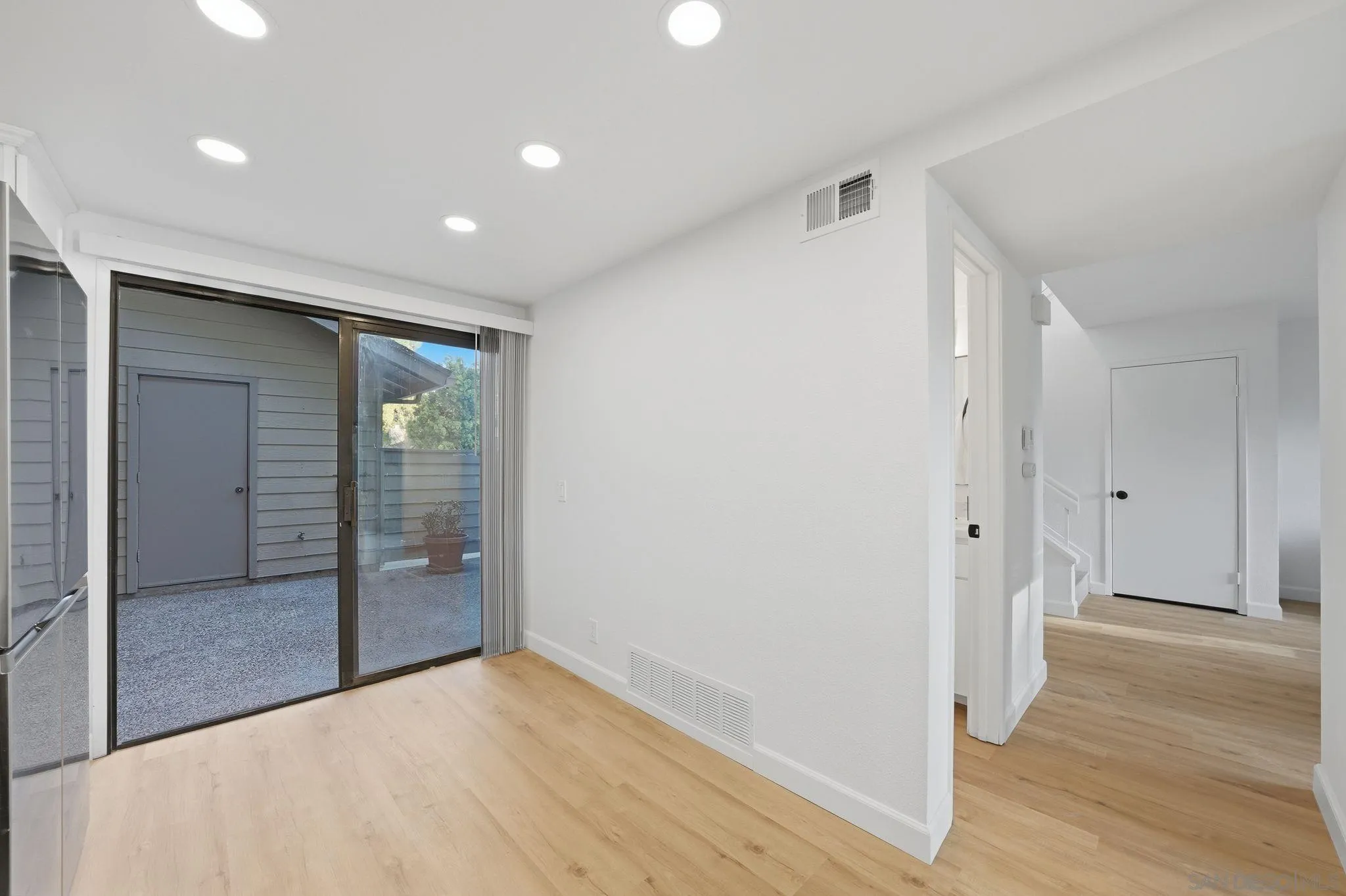 10450 Ridgewater Lane San Diego, CA 92131 - Photo 17 of 47 a view of hallway with wooden floor