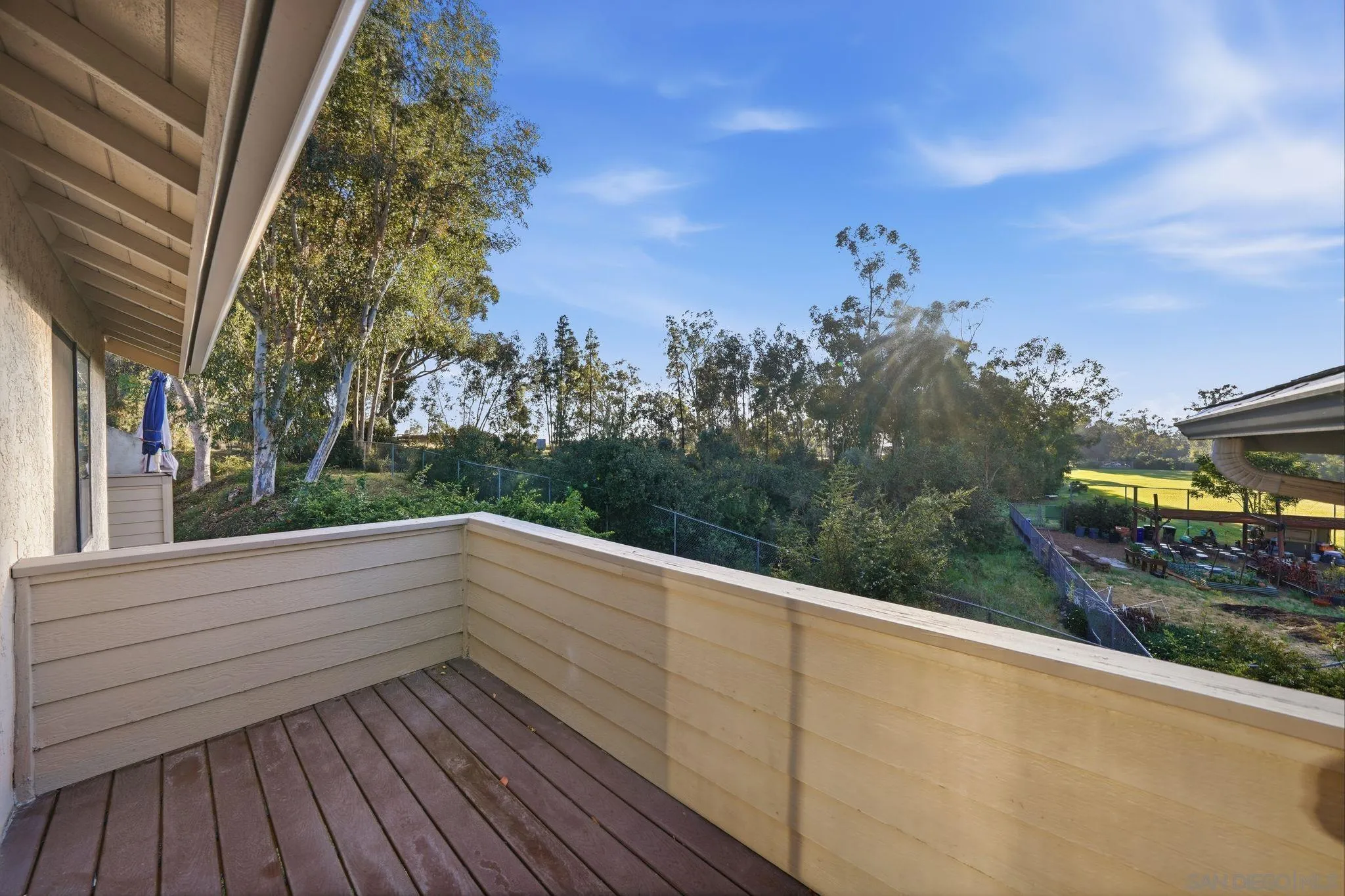 10450 Ridgewater Lane San Diego, CA 92131 - Photo 20 of 47 a view of balcony with wooden floor and fence
