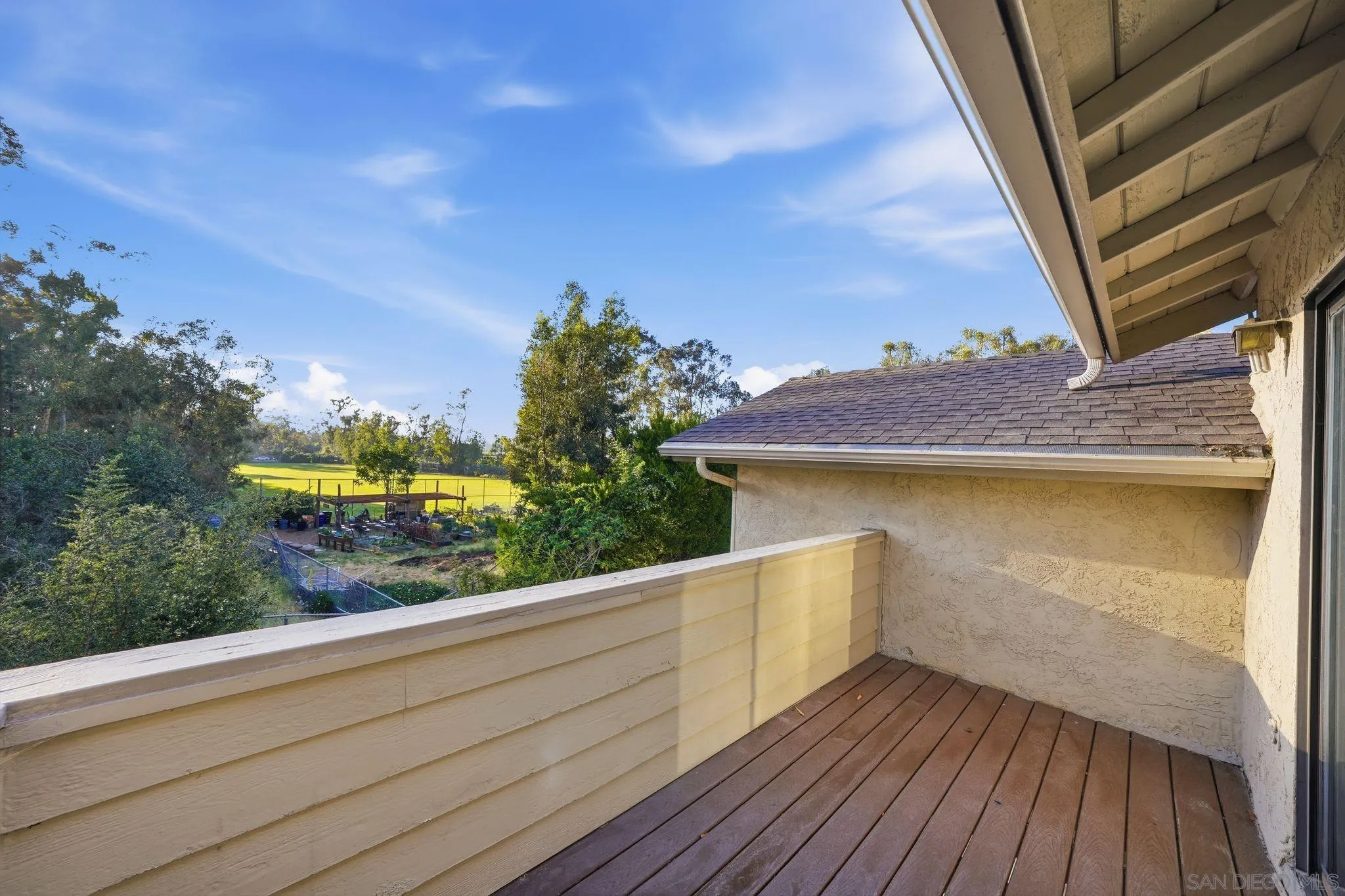 10450 Ridgewater Lane San Diego, CA 92131 - Photo 21 of 47 a view of a balcony with wooden floor and fence