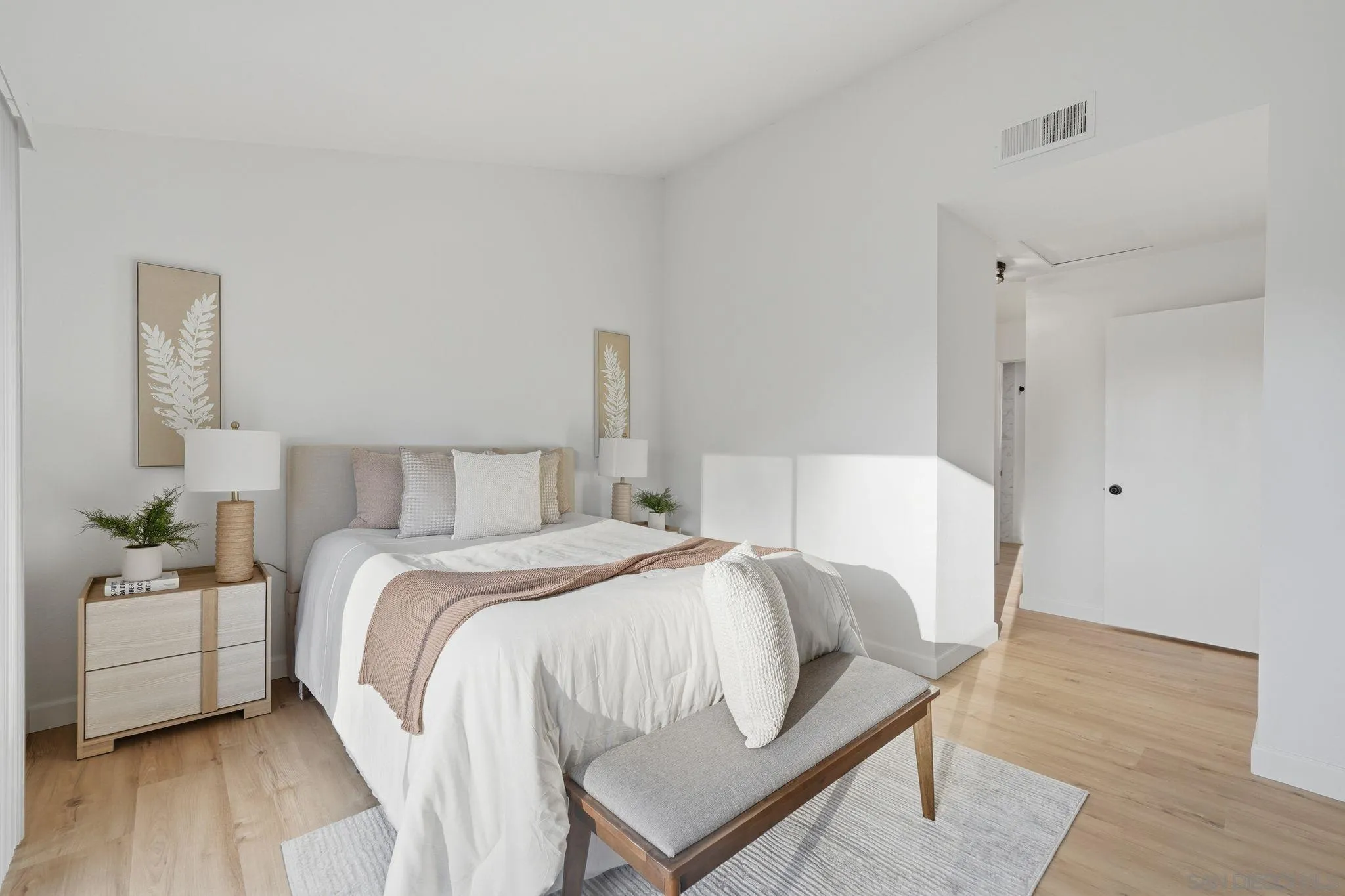 10450 Ridgewater Lane San Diego, CA 92131 - Photo 22 of 47 a bedroom with a bed and wooden floor
