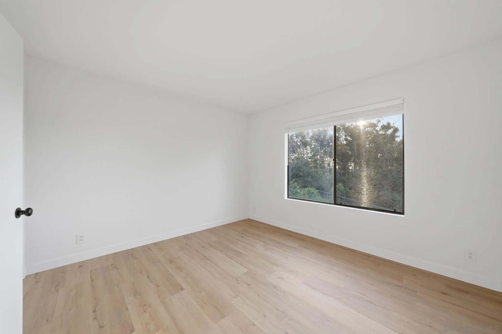 10450 Ridgewater Lane San Diego, CA 92131 - Photo 26 of 47 an empty room with a window