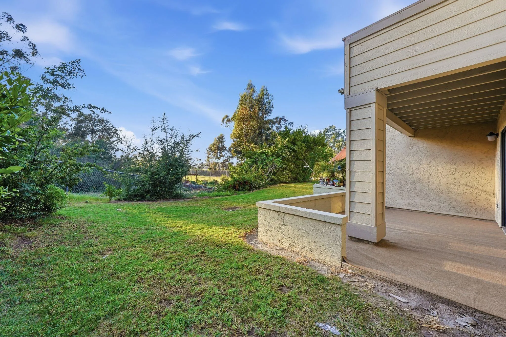 10450 Ridgewater Lane San Diego, CA 92131 - Photo 31 of 47 a view of a tiny house with a yard