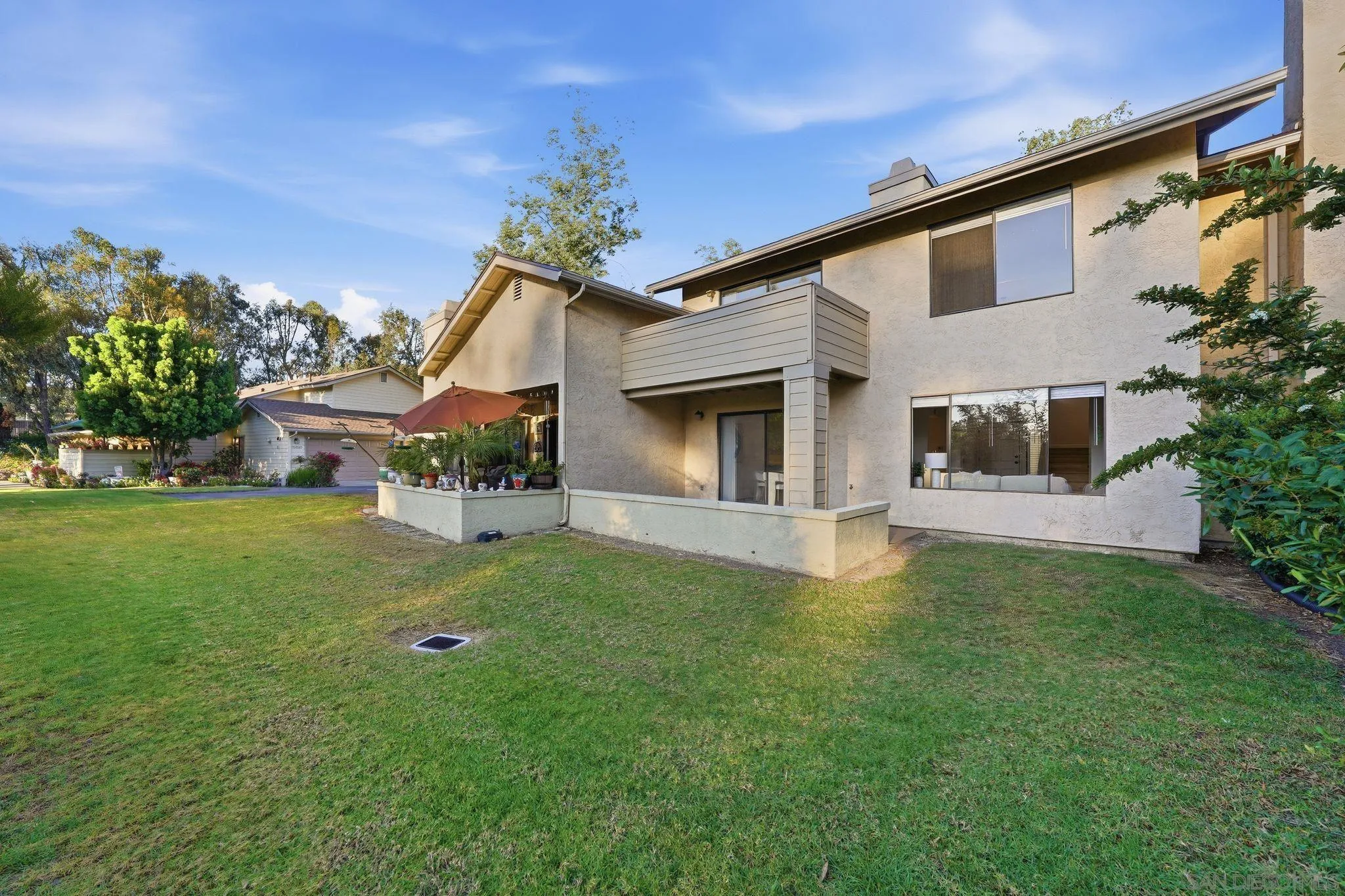 10450 Ridgewater Lane San Diego, CA 92131 - Photo 32 of 47 a front view of a house with a yard and garage