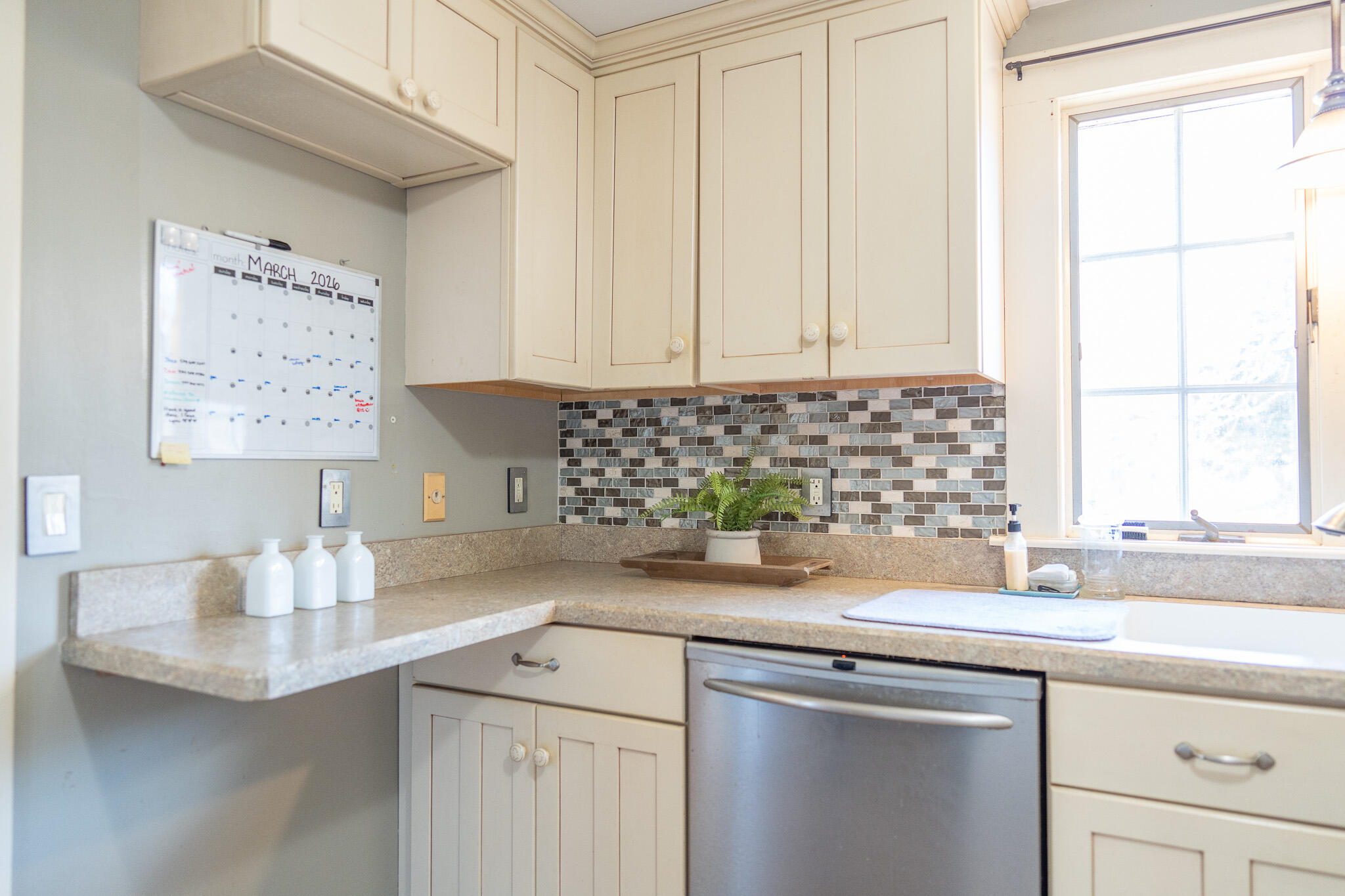49 Monument View Road East Dennis, MA 02660 - Photo 23 of 52 a kitchen with a sink cabinets and window