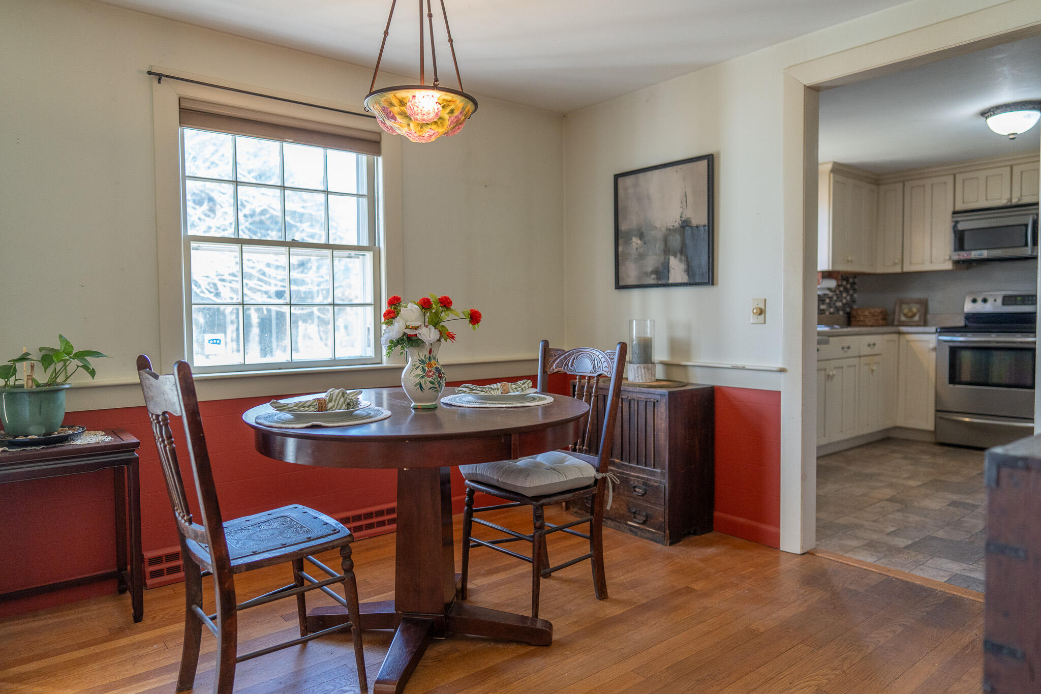 49 Monument View Road East Dennis, MA 02660 - Photo 26 of 52 a dining room with furniture a chandelier and wooden floor