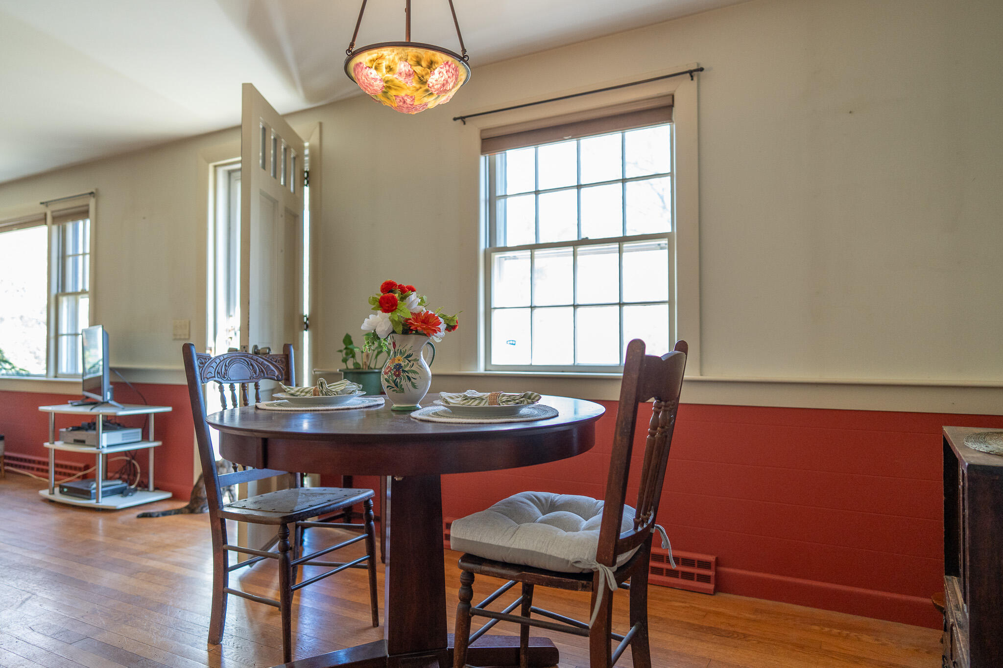 49 Monument View Road East Dennis, MA 02660 - Photo 27 of 52 a view of a dining room with furniture window and wooden floor