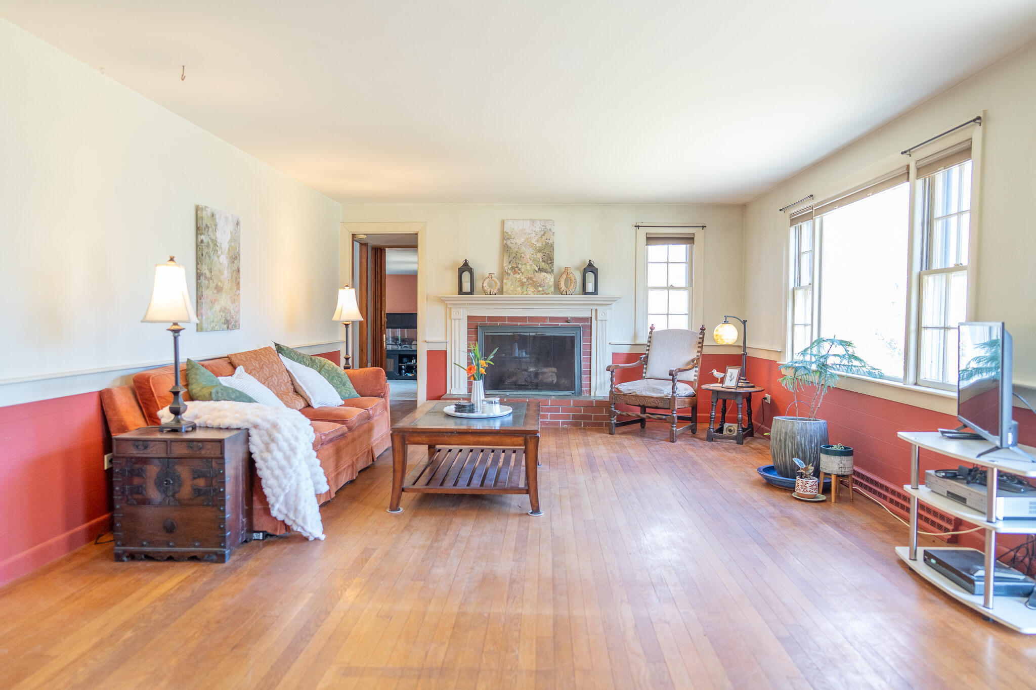 49 Monument View Road East Dennis, MA 02660 - Photo 28 of 52 a living room with furniture and a fireplace