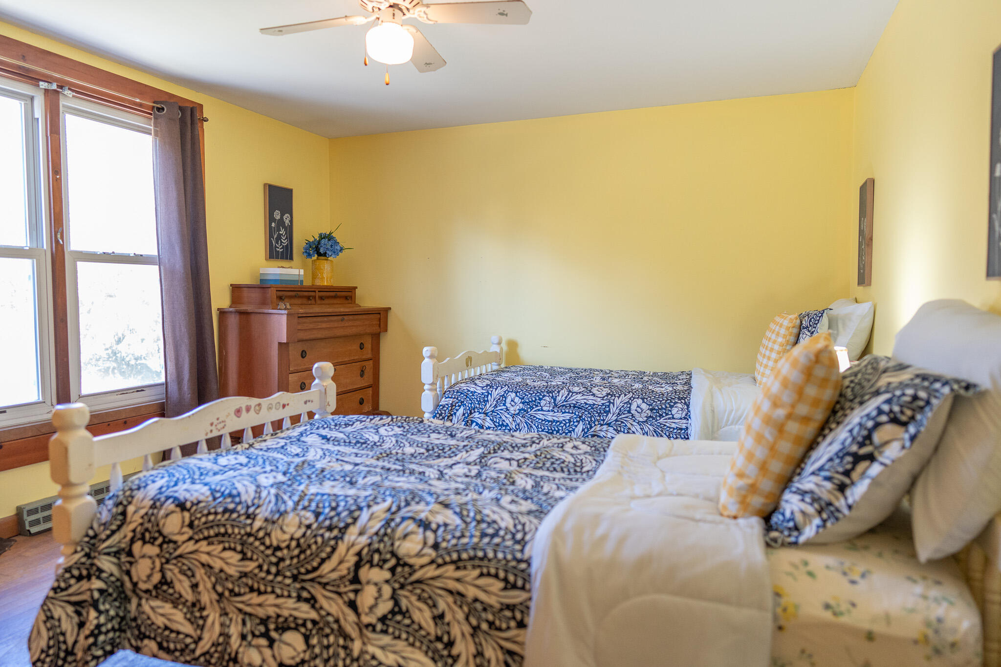 49 Monument View Road East Dennis, MA 02660 - Photo 43 of 52 a bedroom with a bed and wooden floor