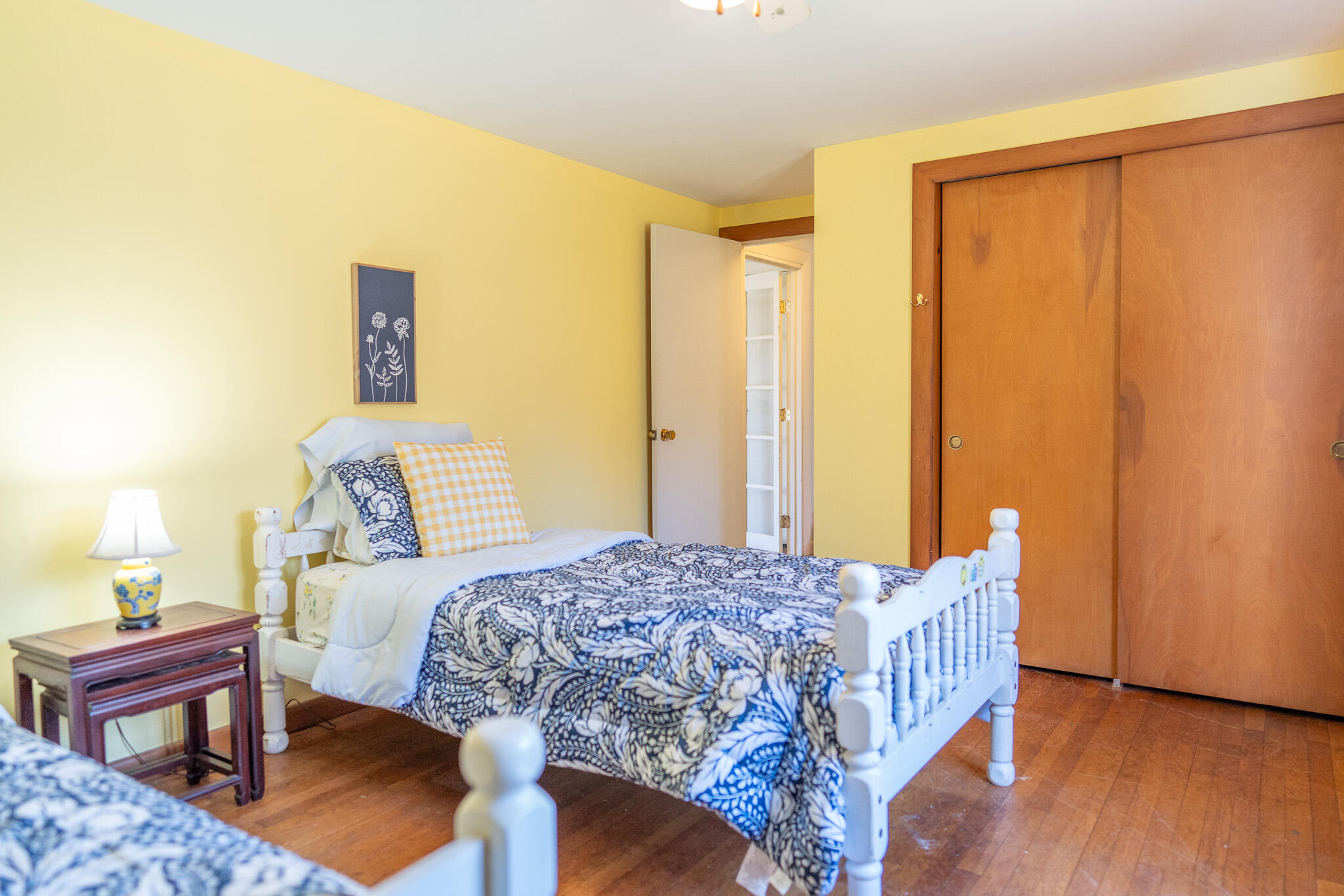 49 Monument View Road East Dennis, MA 02660 - Photo 44 of 52 a bedroom with a bed and wooden floor