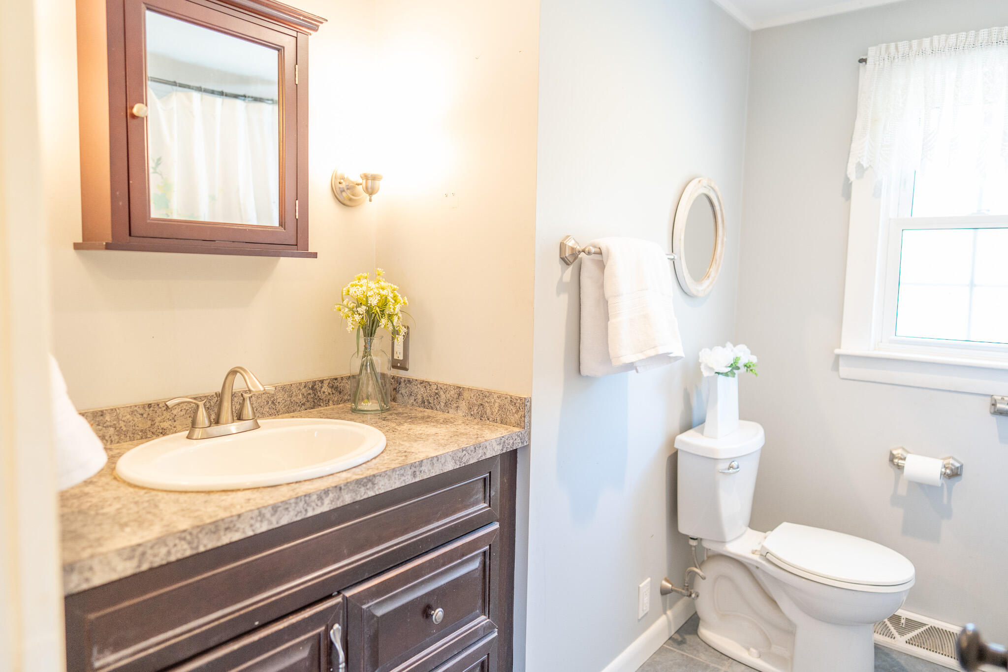 49 Monument View Road East Dennis, MA 02660 - Photo 46 of 52 a bathroom with a granite countertop sink and a toilet