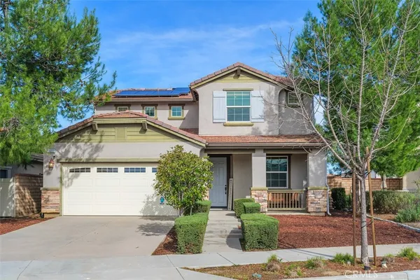 a front view of a house with a garage