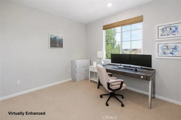 a workspace with furniture and a window