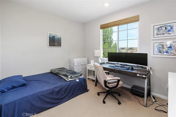 a workspace with furniture and a window