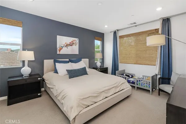 a bedroom with bed and window