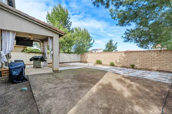 a view of backyard with outdoor seating