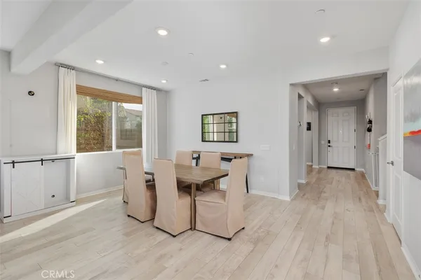 a living room with a sink furniture and a large window