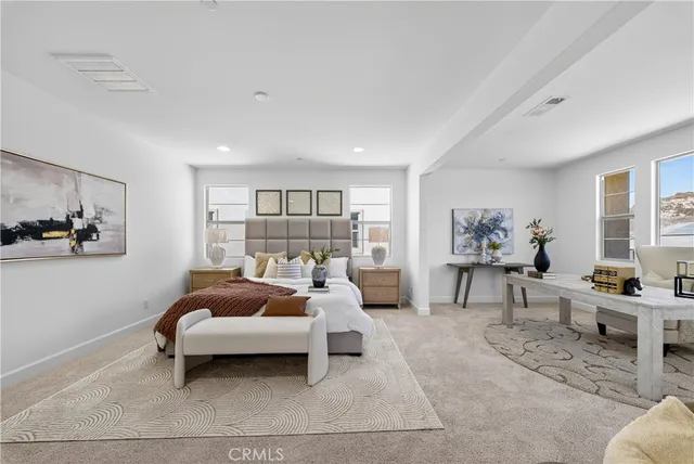 a bedroom with furniture and a couch