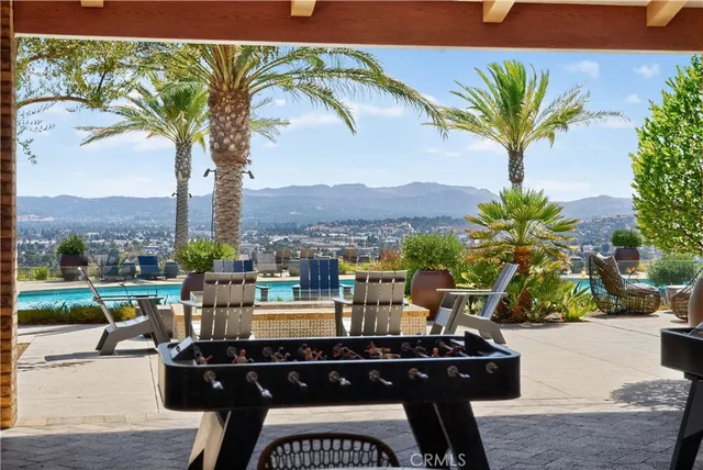 a view of a chairs and table in patio