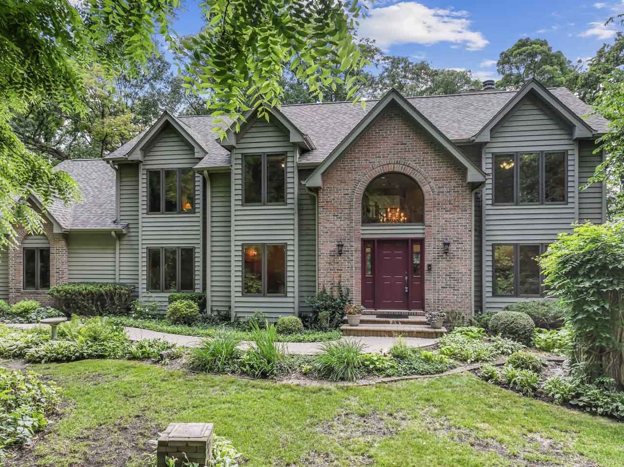 31W139 Rohrssen Road Hoffman Estates, IL 60192 - Photo 1 of 51 a front view of a house with garden