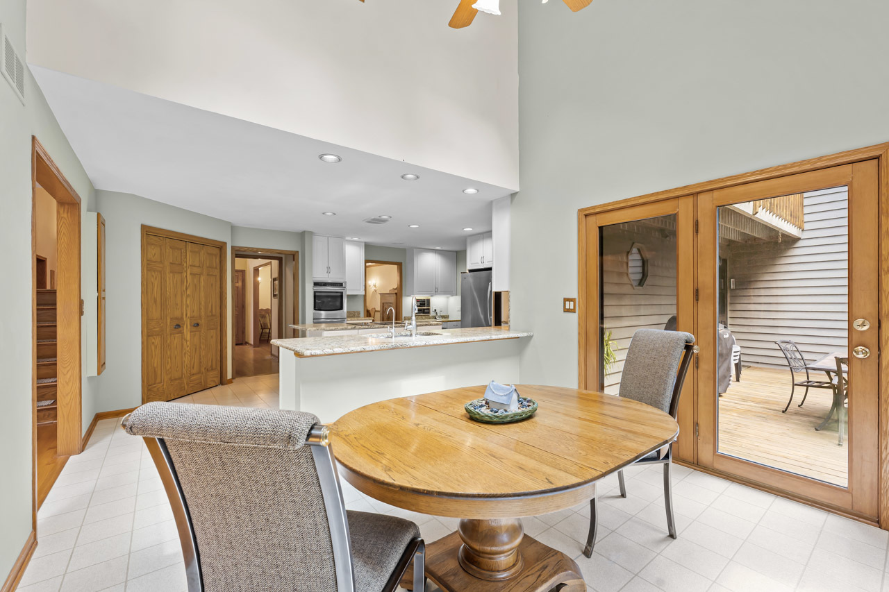 31W139 Rohrssen Road Hoffman Estates, IL 60192 - Photo 23 of 51 a dining room with a table and chairs