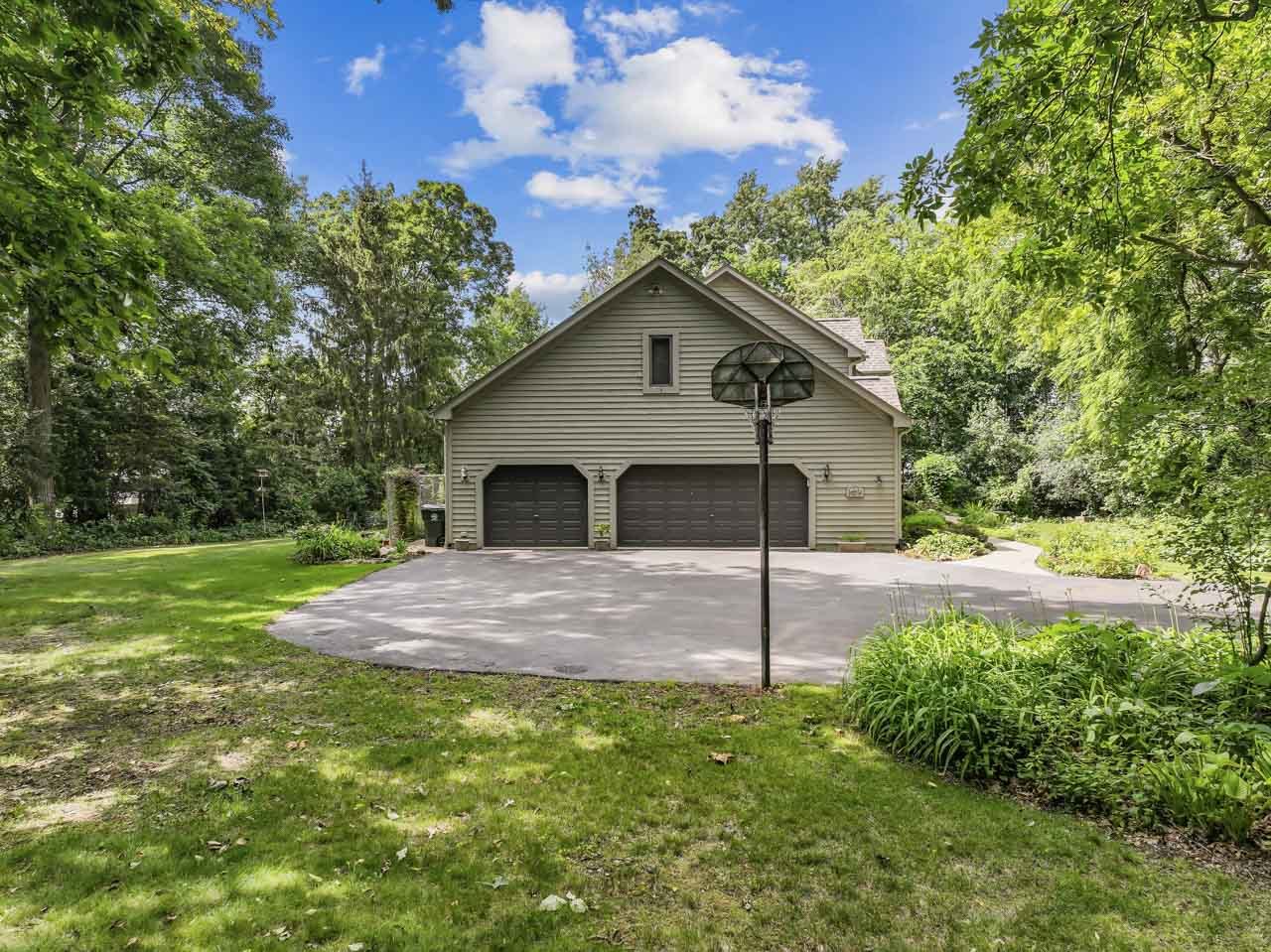 31W139 Rohrssen Road Hoffman Estates, IL 60192 - Photo 4 of 51 a view of a house with a yard and large tree