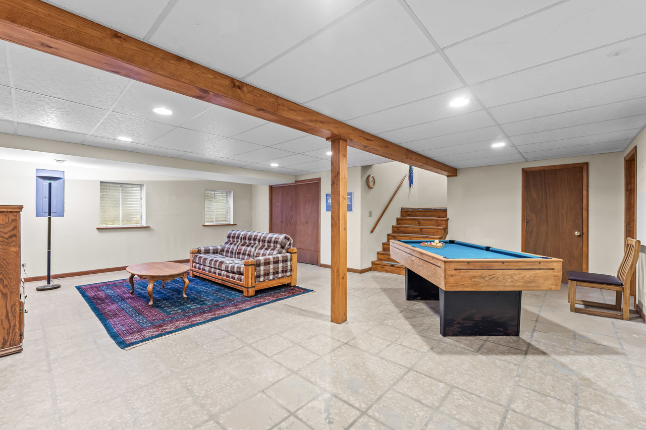 31W139 Rohrssen Road Hoffman Estates, IL 60192 - Photo 41 of 51 a living room with furniture a table and wooden floor