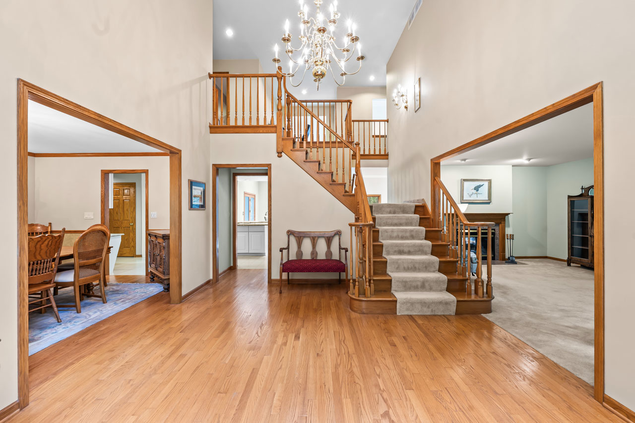 31W139 Rohrssen Road Hoffman Estates, IL 60192 - Photo 6 of 51 a view of entryway livingroom and hall with wooden floor