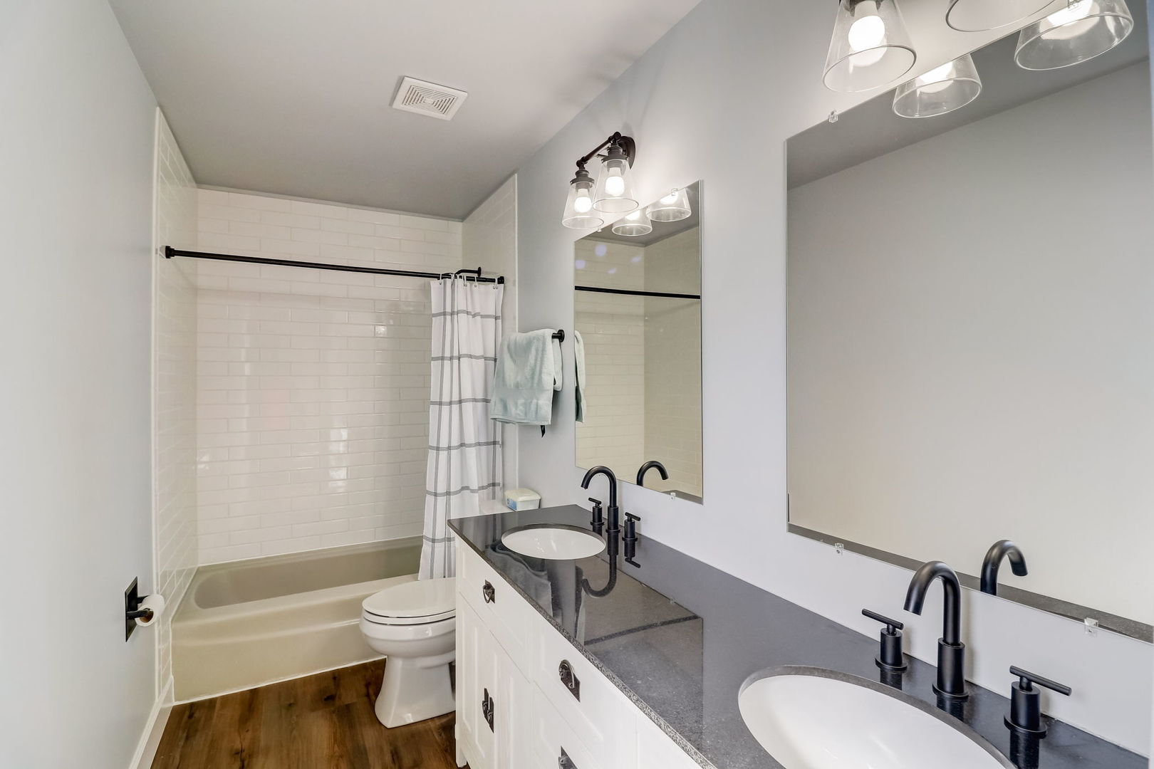 331 Sutcliffe Circle Vernon Hills, IL 60061 - Photo 13 of 26 a bathroom with a sink a toilet a mirror and shower