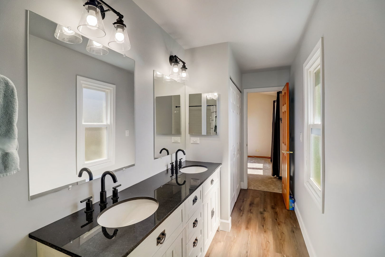 331 Sutcliffe Circle Vernon Hills, IL 60061 - Photo 14 of 26 a bathroom with a sink double vanity granite and a mirror