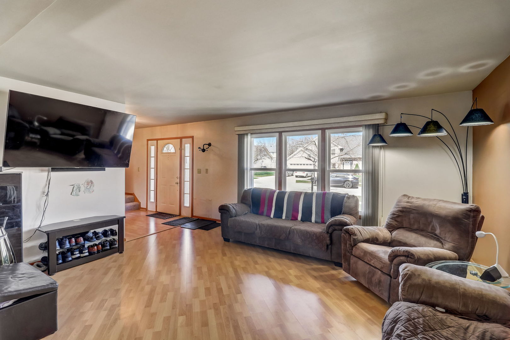 331 Sutcliffe Circle Vernon Hills, IL 60061 - Photo 2 of 26 a living room with furniture and a flat screen tv