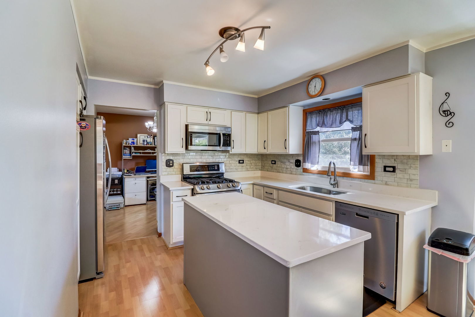 331 Sutcliffe Circle Vernon Hills, IL 60061 - Photo 4 of 26 a kitchen with stainless steel appliances a sink stove refrigerator and cabinets
