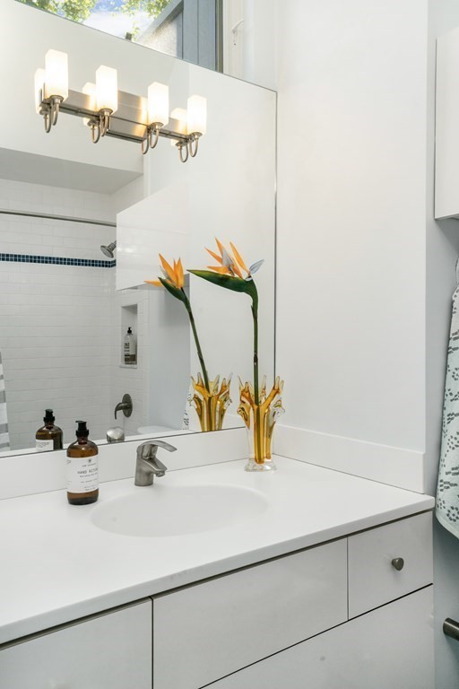 4 Ellery Square Cambridge, MA 02138 - Photo 16 of 23 a bathroom with a sink and a mirror