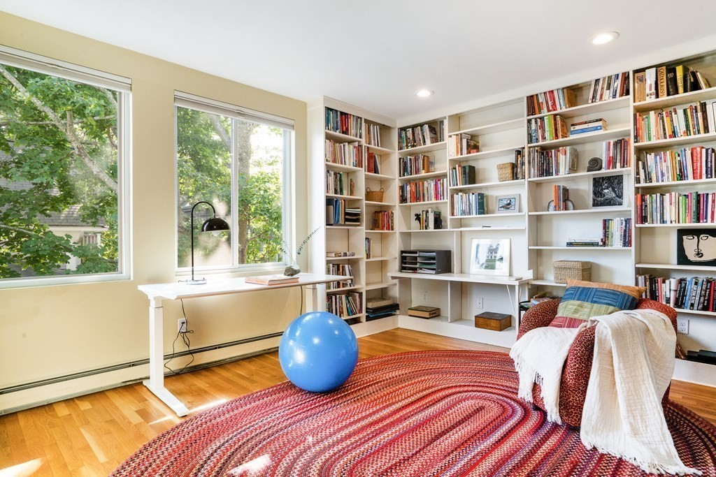 4 Ellery Square Cambridge, MA 02138 - Photo 10 of 23 a bedroom with furniture and a book shelf