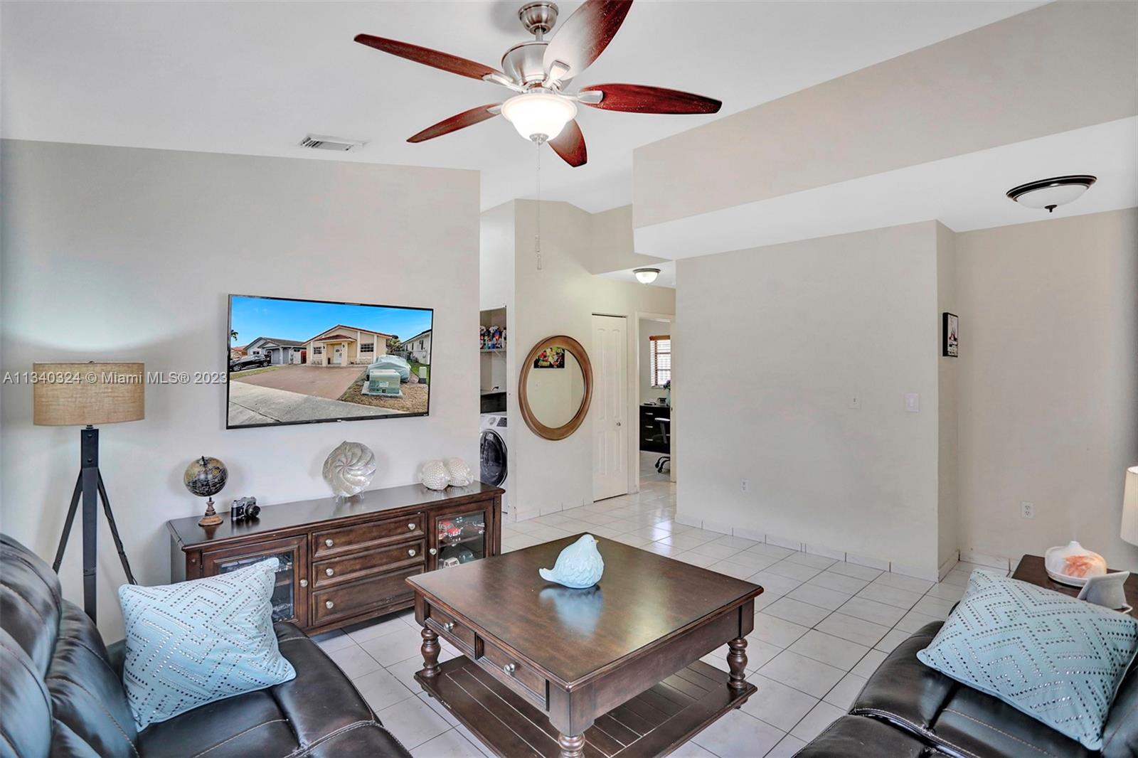 2574 West 71st Place Hialeah, FL 33016 - Photo 41 of 48 a living room with furniture and a table