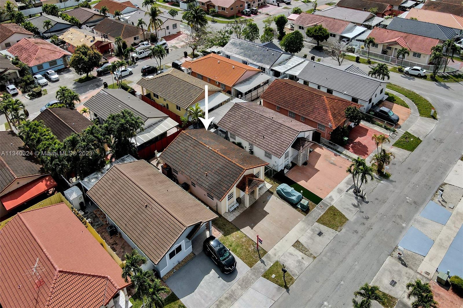2574 West 71st Place Hialeah, FL 33016 - Photo 46 of 48 an aerial view of residential houses with outdoor space