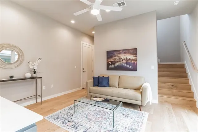 a living room with furniture and a rug