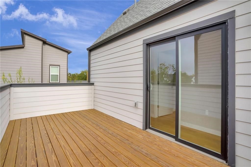 1118 Stobaugh Street, Unit B Austin, TX 78757 - Photo 9 of 12 a view of a balcony with wooden floor