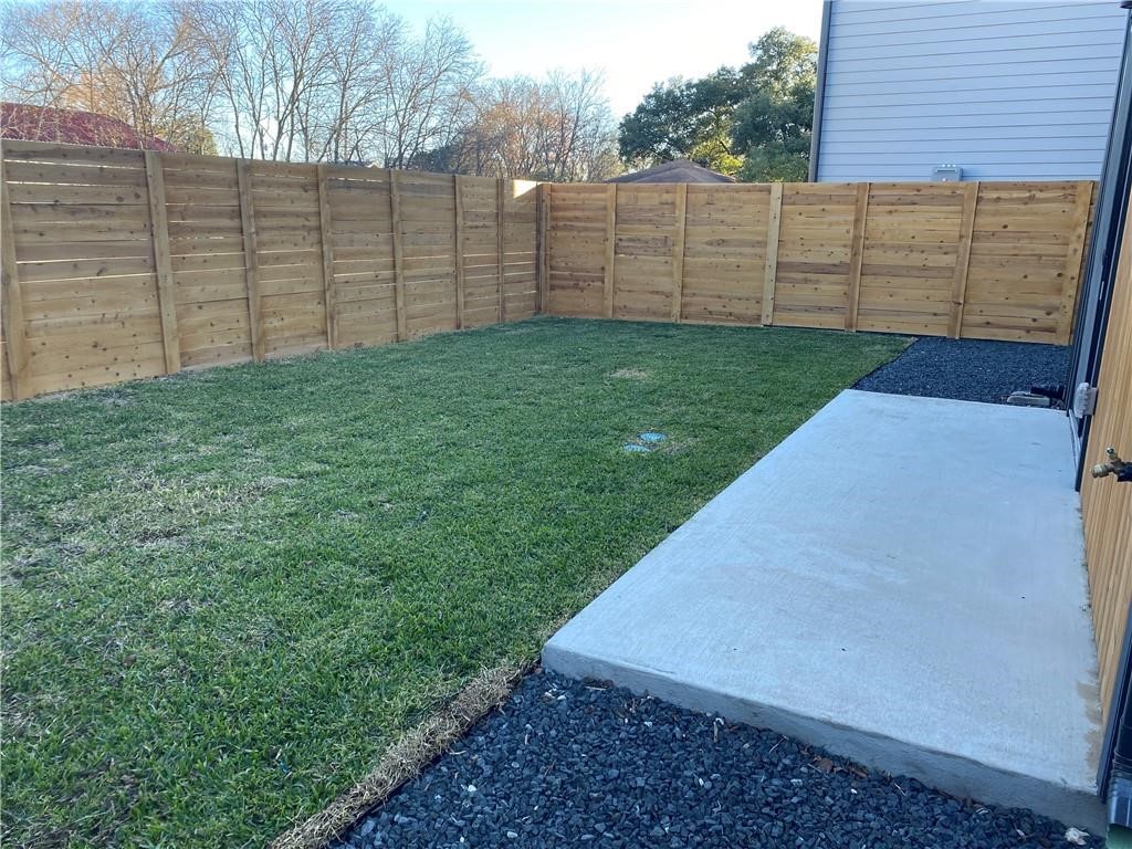 1118 Stobaugh Street, Unit B Austin, TX 78757 - Photo 10 of 12 a view of a backyard