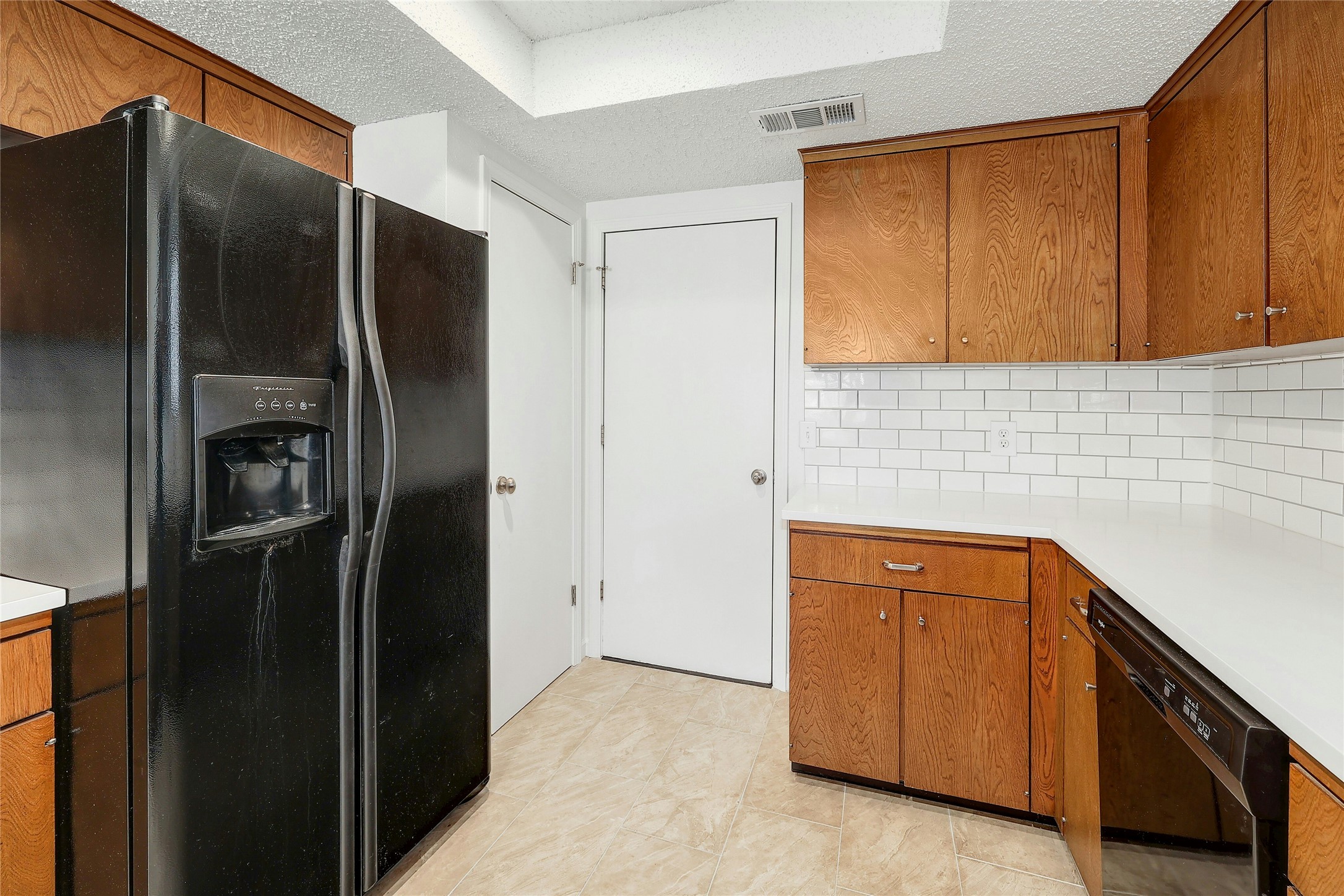 11720 Running Fox Trail Austin, TX 78759 - Photo 15 of 31 a kitchen with stainless steel appliances granite countertop a refrigerator and a sink