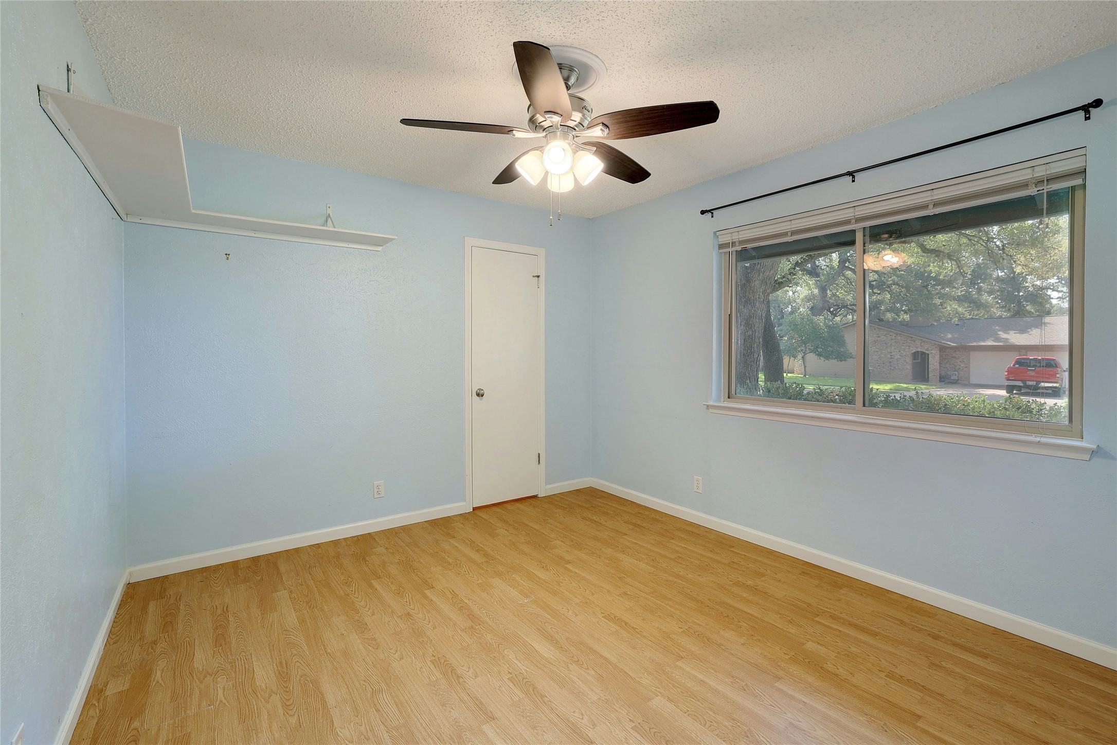 11720 Running Fox Trail Austin, TX 78759 - Photo 22 of 31 a view of empty room with wooden floor