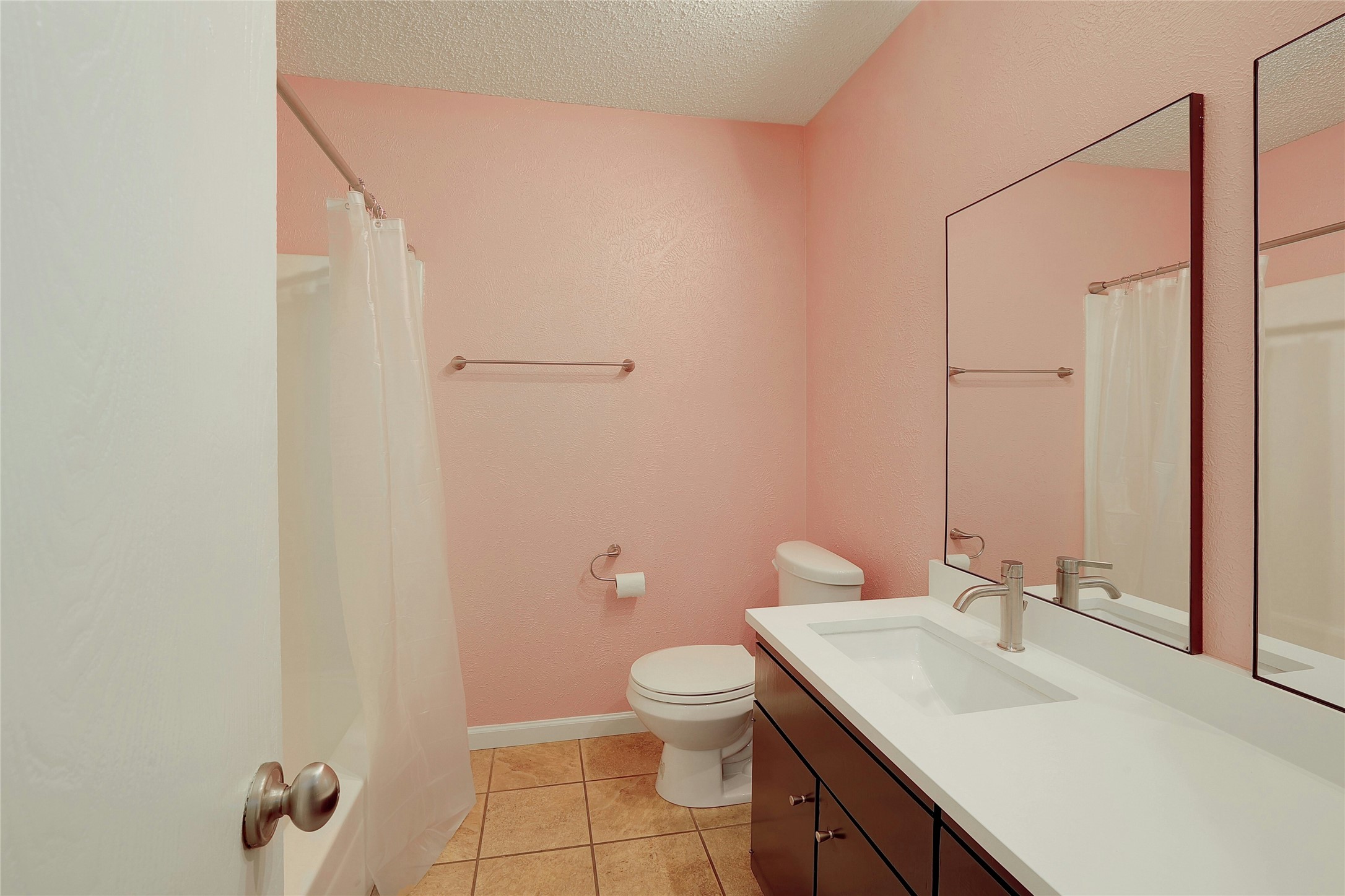 11720 Running Fox Trail Austin, TX 78759 - Photo 24 of 31 a bathroom with a sink a toilet and a mirror